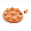 Orange and beige puzzle toy for pets on a white background