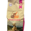 Bag of Whistler's Small Breeds dog food with a dog sitting on a rock in the mountains.