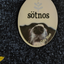 Round sticker with a dog's nose and 'sötnos' branding on a textured black background