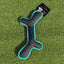 Black and teal dog toy on grass with a brand label.