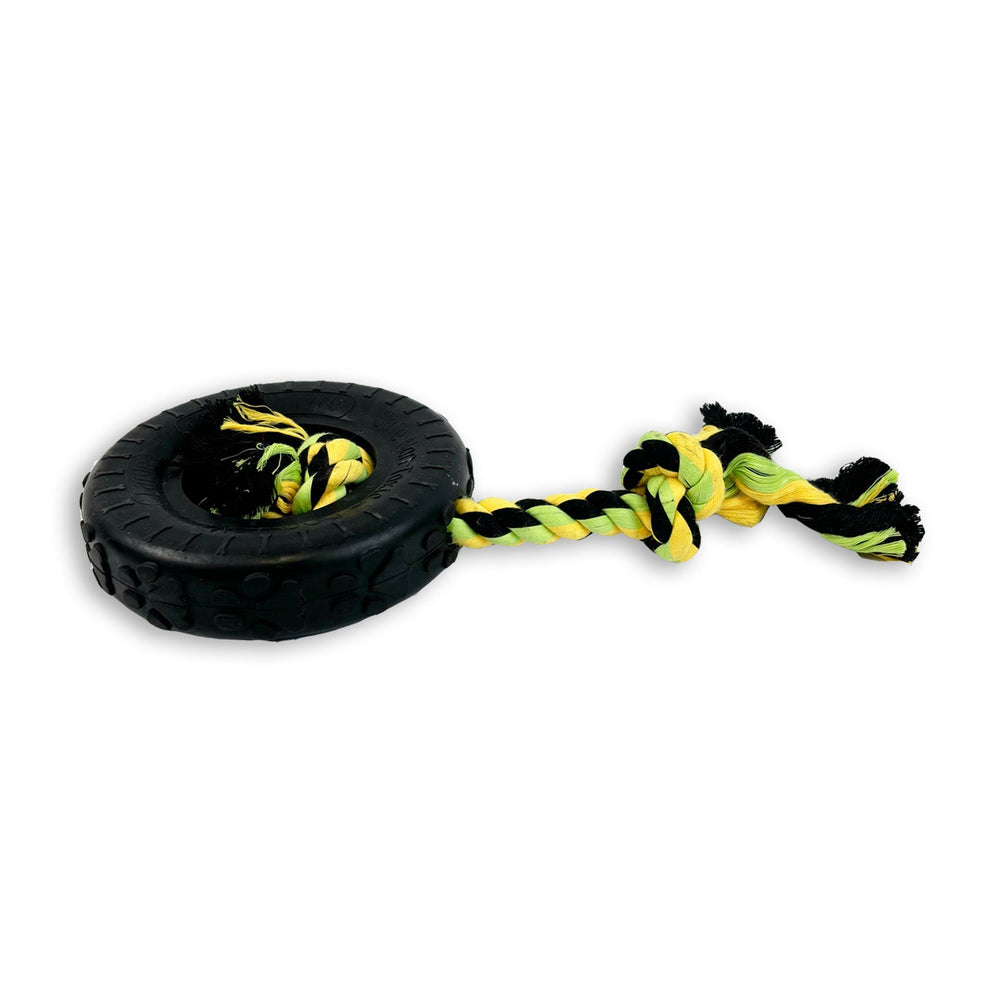 Dog toy with black tire and yellow rope on a white background