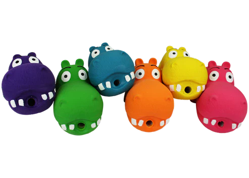 Set of colorful hippo-shaped dog toys on a white background