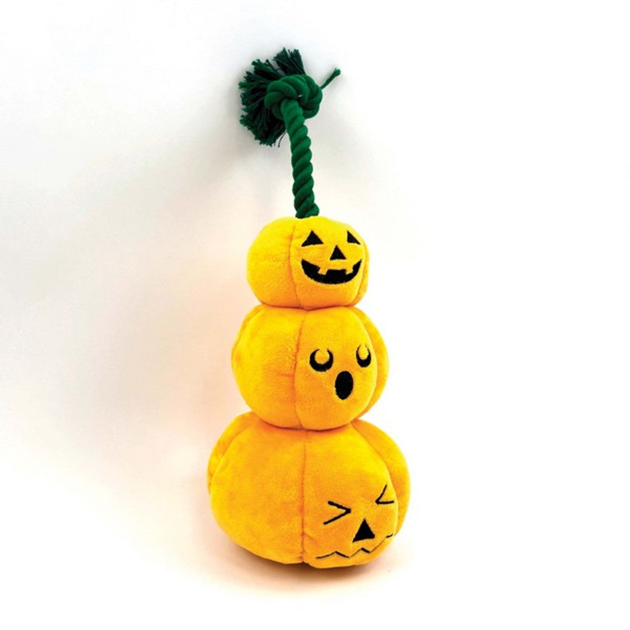 Stacked yellow pumpkin plush dog toy with a green rope on a white background