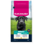Eukanuba dog food package with a black dog on grass