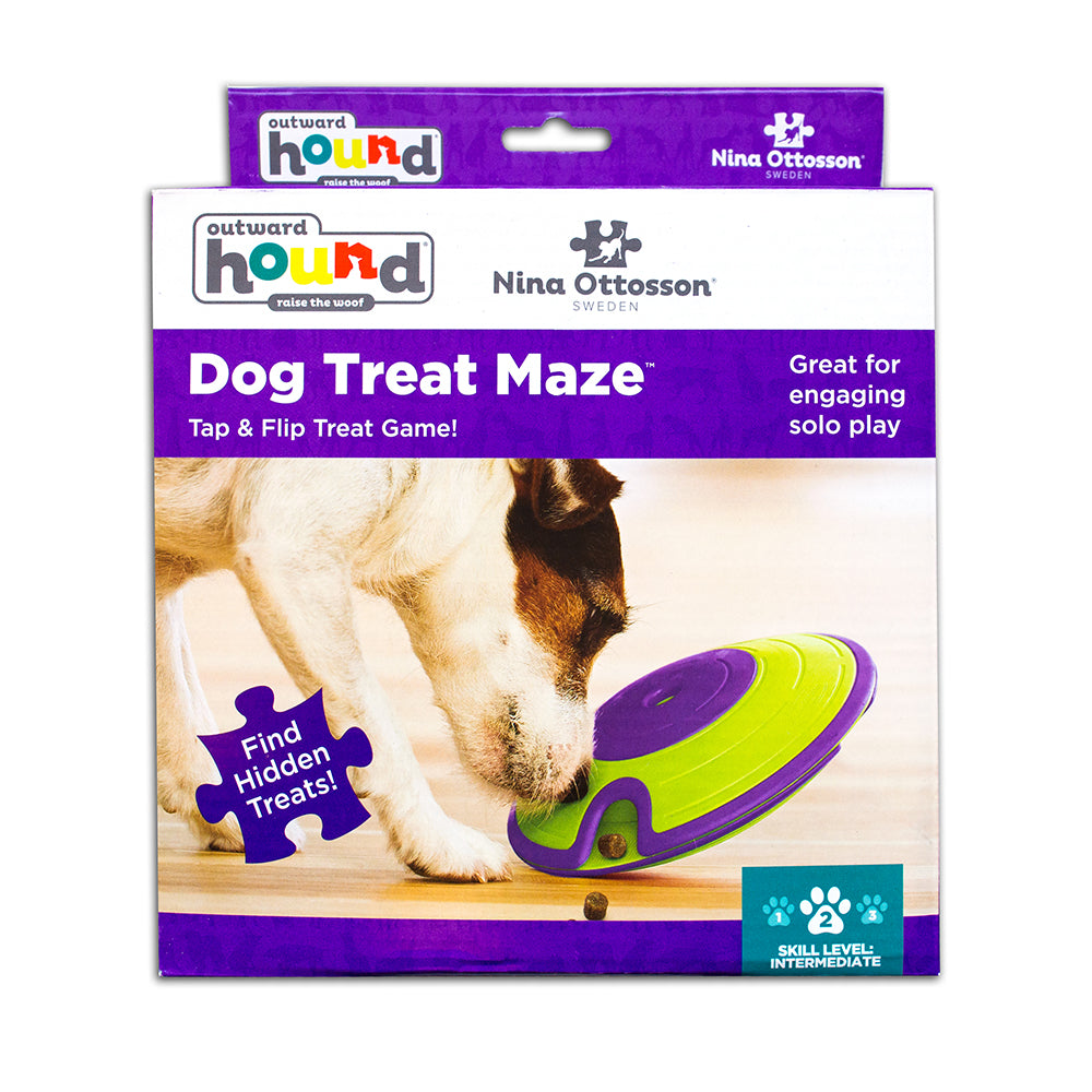 Dog treat maze toy with packaging featuring Nina Ottosson branding on a white background