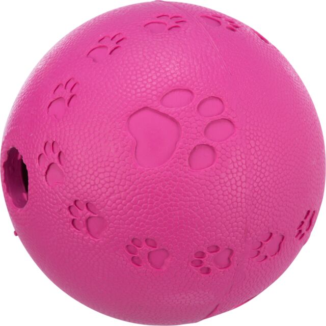 Pink rubber ball dog toy with paw print designs on a white background
