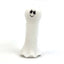 White ghost dog toy with a smiley face on a white background